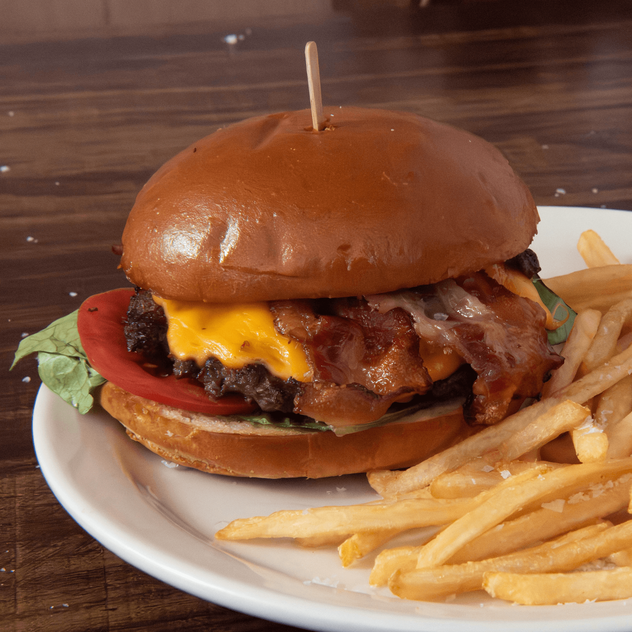 Wagyu Cheddar Smash Burger with Grilled Onions.